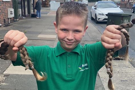 Bobby, 8, grows his hair just to have it cut for The Little Princess Trust.
